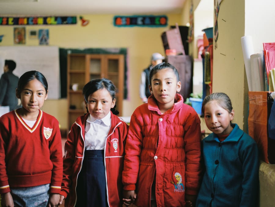Four little girls at school in Cartompata, Peru