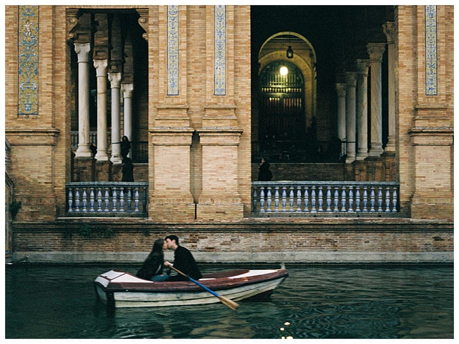 This beautiful couple in a row boat enjoyed their adventurous couple session on the Plaza de Espana in Seville, Spain was taken by J.J. Au'Clair, a destination couple photographer!
