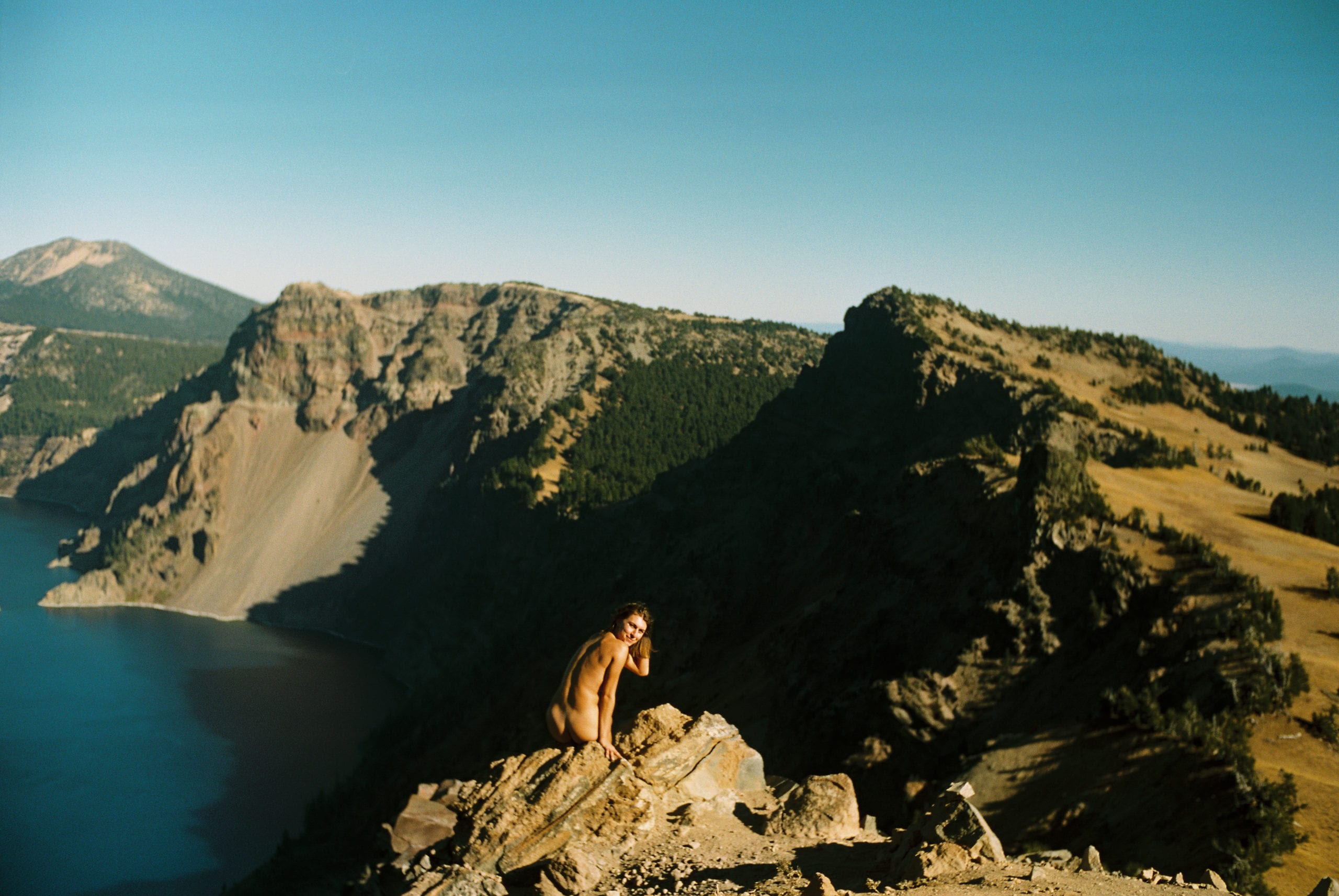 Adventurous boudoir session over Crater Lake in Oregon, to inspire wanderlust and promote self love!